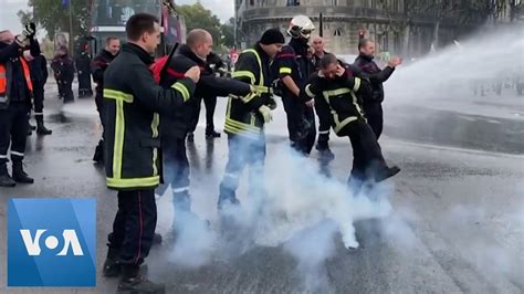 Police Fire Water Cannon At Protesting Firefighters In France Youtube