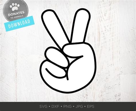 A Peace Sign Drawn In The Shape Of A Hand On Top Of A Wooden Table