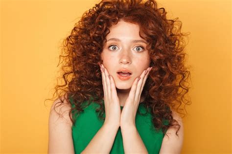 premium photo close up portrait of a surprised curly redhead woman