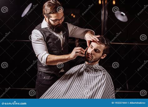 Skillful Barber Young Man Getting An Old Fashioned Shave With S Stock
