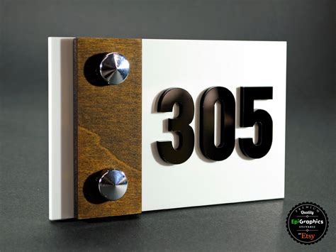 A Close Up Of A Wooden And Metal Sign With The Number 350 Written On It