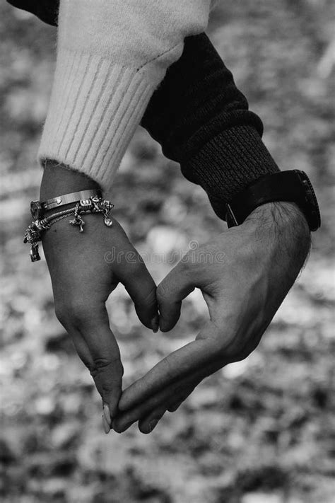 A Couple In Love Shows A Heart With Their Hands Stock Photo Image Of