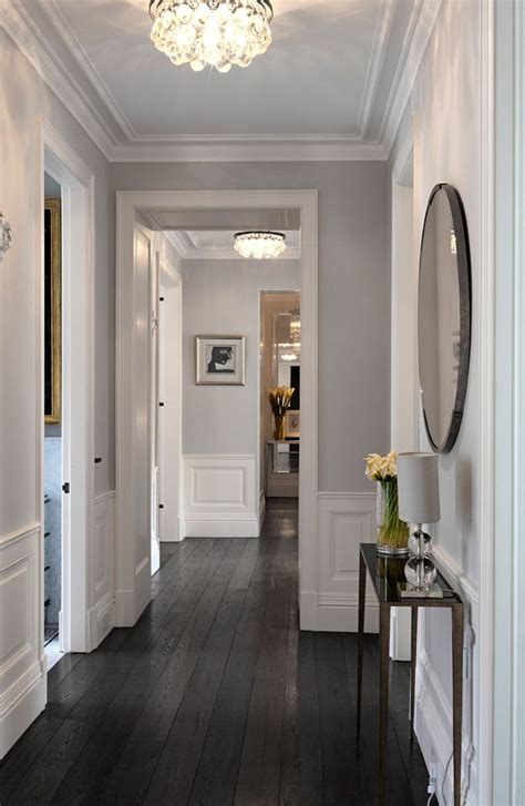 Dark hardwood floors are rich and resonant. Love these dark wood floors, white wainscoting and gray ...