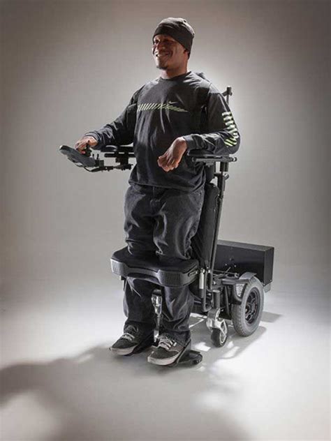 this picture features a man experiencing standing wheelchair benefits first hand wheelchair