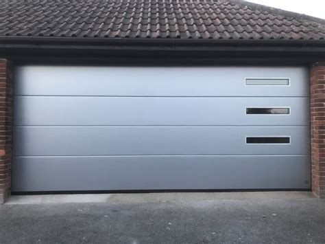 Gryphon's sectional garage doors are not only elegant, sophisticated and modern in design, there's also endless customisation possibilities. Automated, Sectional Garage Door - Dorset Garage Doors