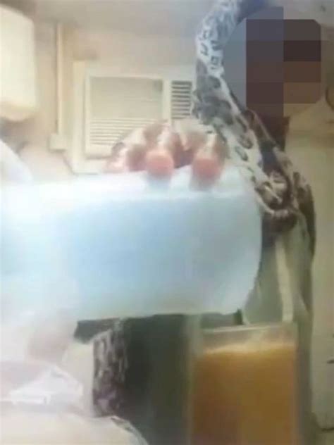sickening video shows hotel maid urinating into glass of juice prepared for customer mirror