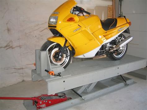 Sloped, to facilitate mounting the motorcycle on the lift, and flat, to serve as a work surface after pivoting. ZUMAFORUMS.NET - View topic - diy motorcycle lift