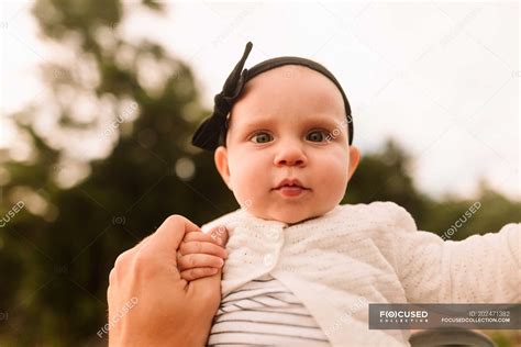 Portrait Of Baby Girl Holding Mothers Hand Close Up — Hair Band