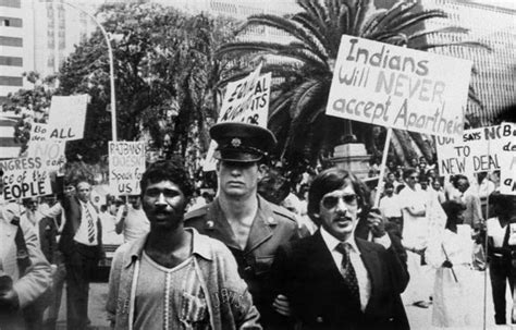 A Policeman Arrests Two Indian Men Of South Africa On November During A Demonstration