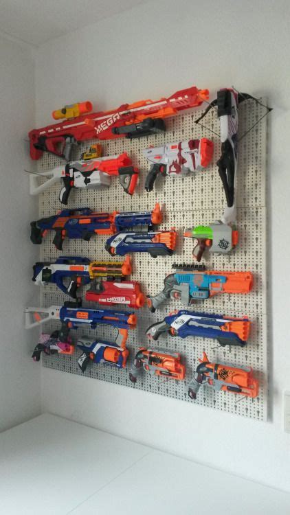 Now take out all of your airsoft guns, nerf guns, foam swords, minecraft pickaxes, and whatever else you would like to hang and start to add it. nerf gun pegboard - Google Search | g a m e r o o m ...