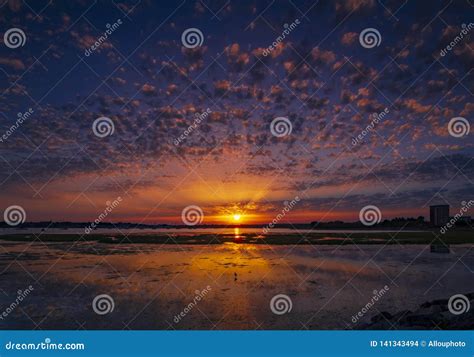 Spectacular Sunset Over Holes Bay Poole Harbour In Dorset Stock Photo