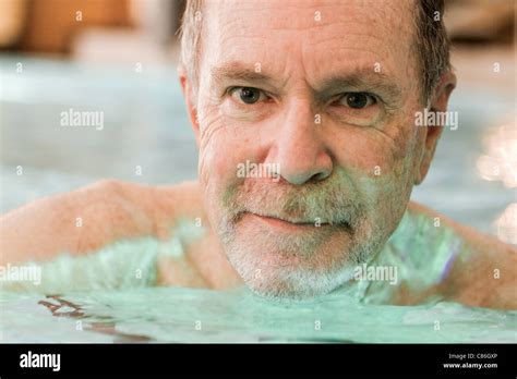 Older Man Swimming In Pool Stock Photo Alamy