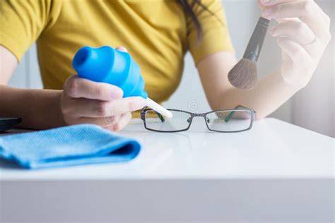 Hand Woman Cleaning Her Glasses With Clothclean Lenses Of Eyeglasses