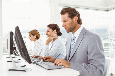 Business People Using Computers In Office 864967 Stock Photo At Vecteezy