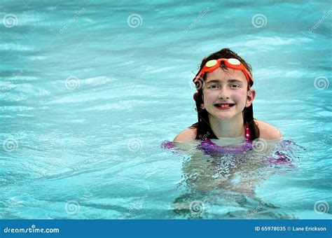 Young Girl Swimming In Pool With Orange Goggles Stock Image Image Of