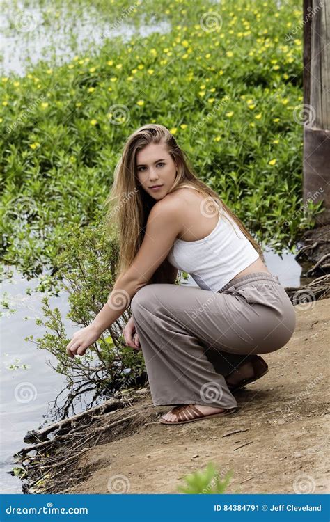 Caucasian Teen Girl Squatting On River Bank Stock Image Image Of Lady