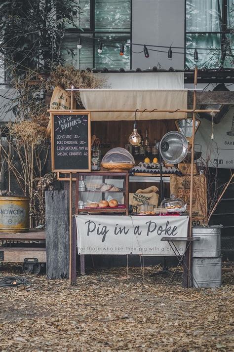 An Outdoor Food Stand With Various Foods On Display