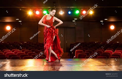 Sexy Flamenco Dancer Performing Her Dance In A Red Long Dress Stock