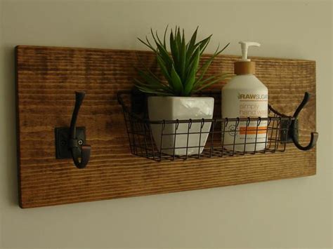 Wire shelves — frequently a staple of garage or basement organizing projects — might not be the first thing you think of adding to. Rustic Bathroom Shelf with Wire Basket and Towel Hooks ...