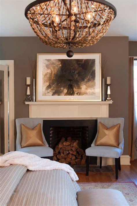 Transitional Master Bedroom With Chandelier And Fireplace