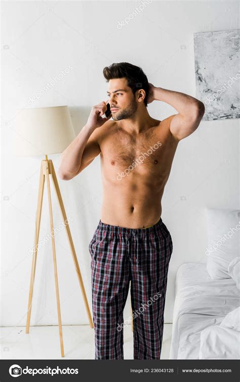 Shirtless Thoughtful Man Talking Smartphone Bedroom Stock Photo By