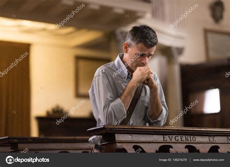Man Praying In Church — Stock Photo © Stokkete 136274270