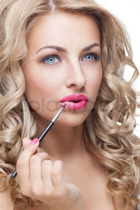Beautiful Girl Putting Lipstick On Stock Image Colourbox