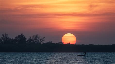 Dusk And Sunset Over The River With Large Sun Image Free Stock Photo