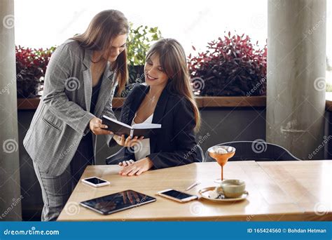 Two Businesswomen Working In A Cafe Stock Photo Image Of Lifestyle