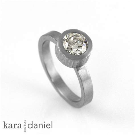 Over half of all proposers added custom details to the engagement ring, with 31 percent going so far as to completely design the jewel from scratch. non-conflict canadian diamond engagement ring ~ bezel-set solitaire in stainless steel | Ring ...