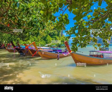 Thai Traditional Wooden Long Tail Boats Parked On Tropical Railay Beach
