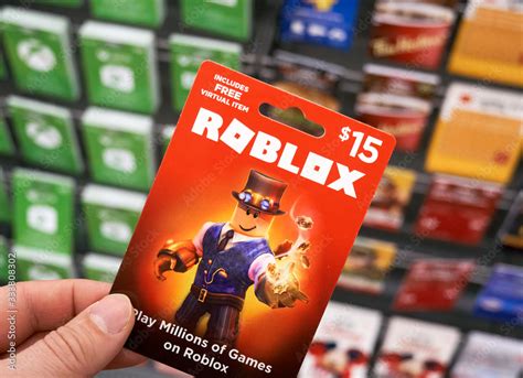 Roblox T Card In A Hand Over T Cards Background Stock Foto