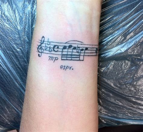 Pin up and drum kit tattoo. 32 Cool Music Note Tattoo Ideas