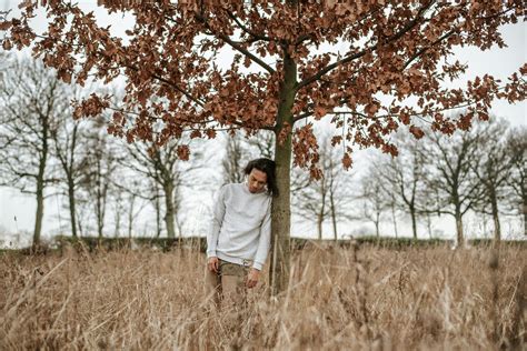 Man Leaning Against A Tree · Free Stock Photo
