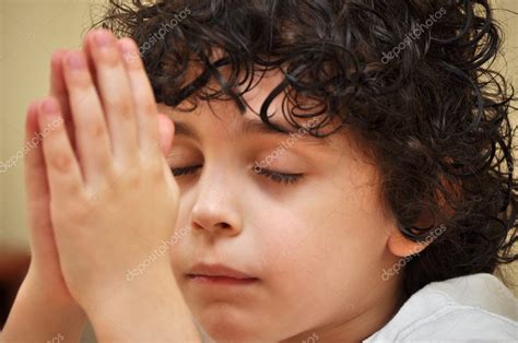 Latin Young Boy Praying With Faith And Reverence — Stock Photo © Yelo34