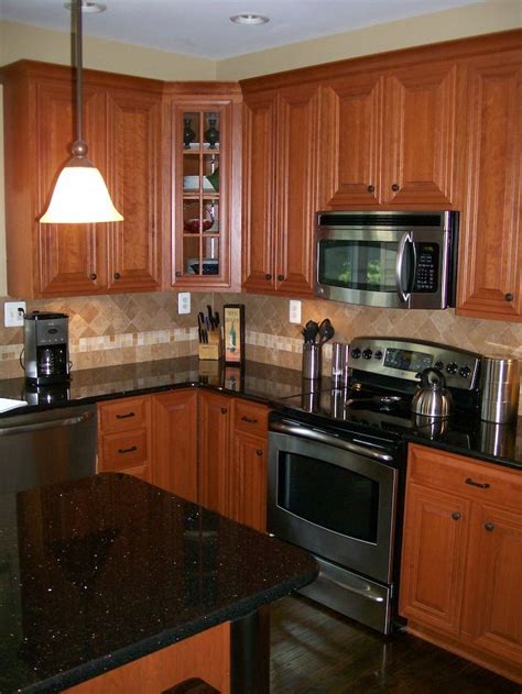 Sometimes refacing requires the veneer to be nailed to the old finish, but usually adhesive is. Refaced kitchen cabinets | Kitchen Magic Refacers ...