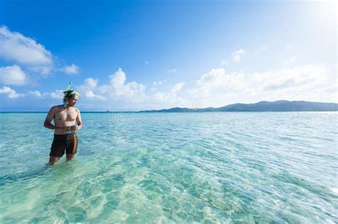 Man Standing In Clear Tropical Beach Water Okinawa Japan Stock Image