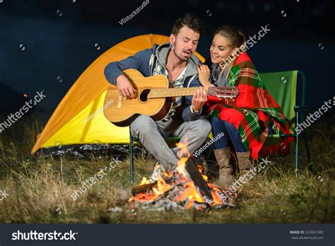 Romantic Evening Couple Campfire While Camping Playing
