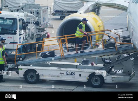 Gatwick airport baggage handlers Stock Photo - Alamy