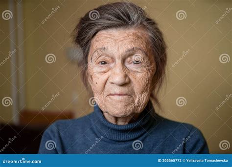 Elderly Caucasian Senior Grandmother Ninety Years Old Looks Attentively And Smiles Feels Happy