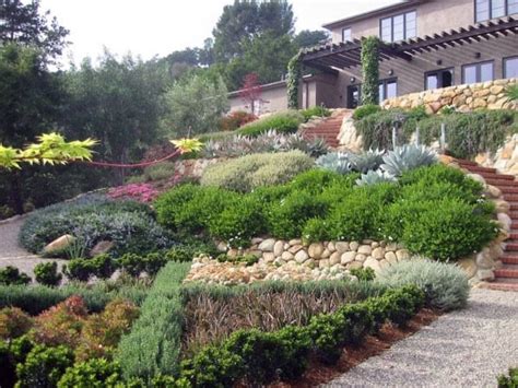 In this backyard landscaping idea, the path itself is defined by the way the homeowner has placed the curving bushes. Top 50 Best Slope Landscaping Ideas - Hill Softscape Designs