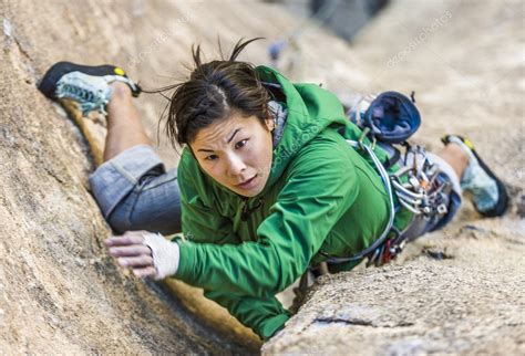 Female Climber Clinging To A Cliff Stock Photo By ©gregepperson 10643183