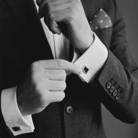 Handsome Groom Dressed In Black Formal Suit White Shirt And Tie Is Getting Ready For Wedding