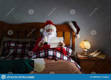 Compatible with cricut, silhouette and other cutting machines. Santa Claus Reading Letters By Candlelight In Bed At His ...