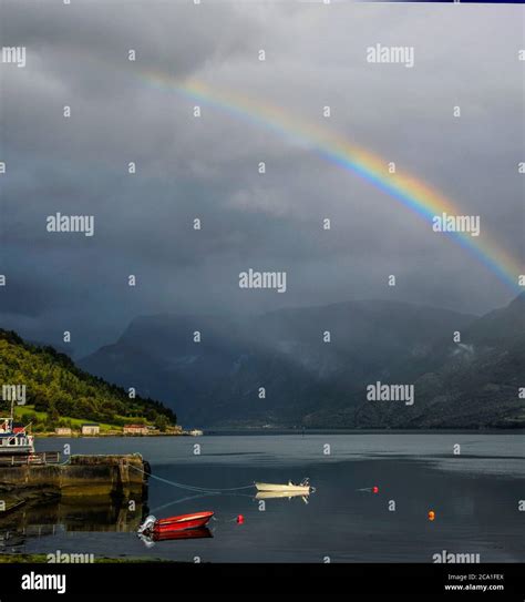A Rainbow Over Boats In Solvorn Norway Solvorn Sits At The Most