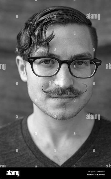 Young Man With Moustache And Glasses Stock Photo Alamy