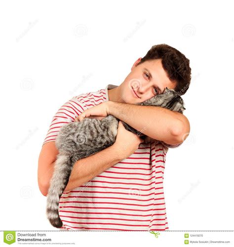 a guy holding a scottish cat in his arms and feels caressing from him emotional man isolated on