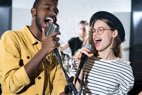 Creative Young People Singing - Stock Photos | Motion Array