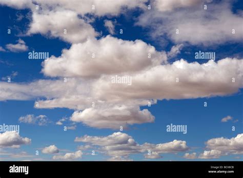 Puffy Clouds In Desert Sky Stock Photo Alamy