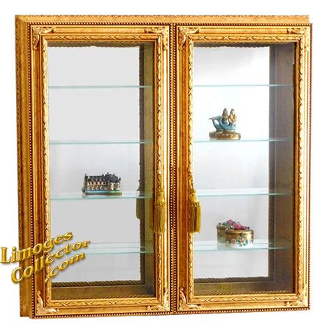 To go contemporary, pair your white cabinets with black hardware. Italian Gold-Leaf Beveled Glass Curio Display Cabinets Arrive at LimogesCollector.com | Newswire